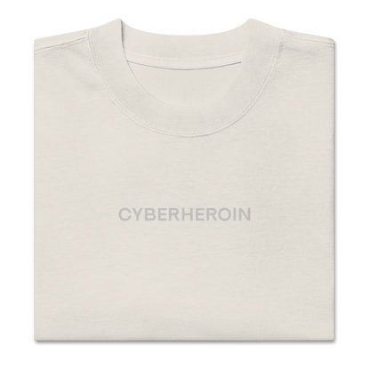 Folded view of NECROBLEND’s oversized unisex T-shirt — formula-x from The Unspoken capsule in faded bone. A piece of speculative apparel referencing digital symptoms.