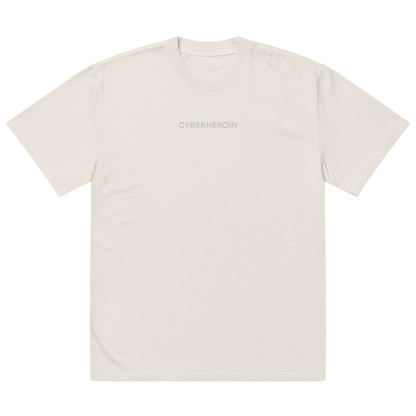 Oversized unisex T-shirt by NECROBLEND — formula-x model from The Unspoken capsule, front view in faded bone. Displays a censored phrase from speculative apparel archive.