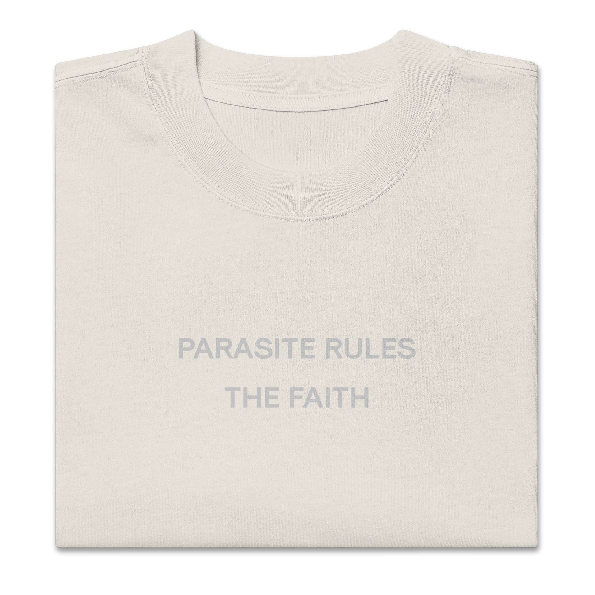 Folded view of NECROBLEND’s oversized unisex T-shirt — signal fragment in faded bone. A softshell of speculative apparel concealing a parasitic invocation.