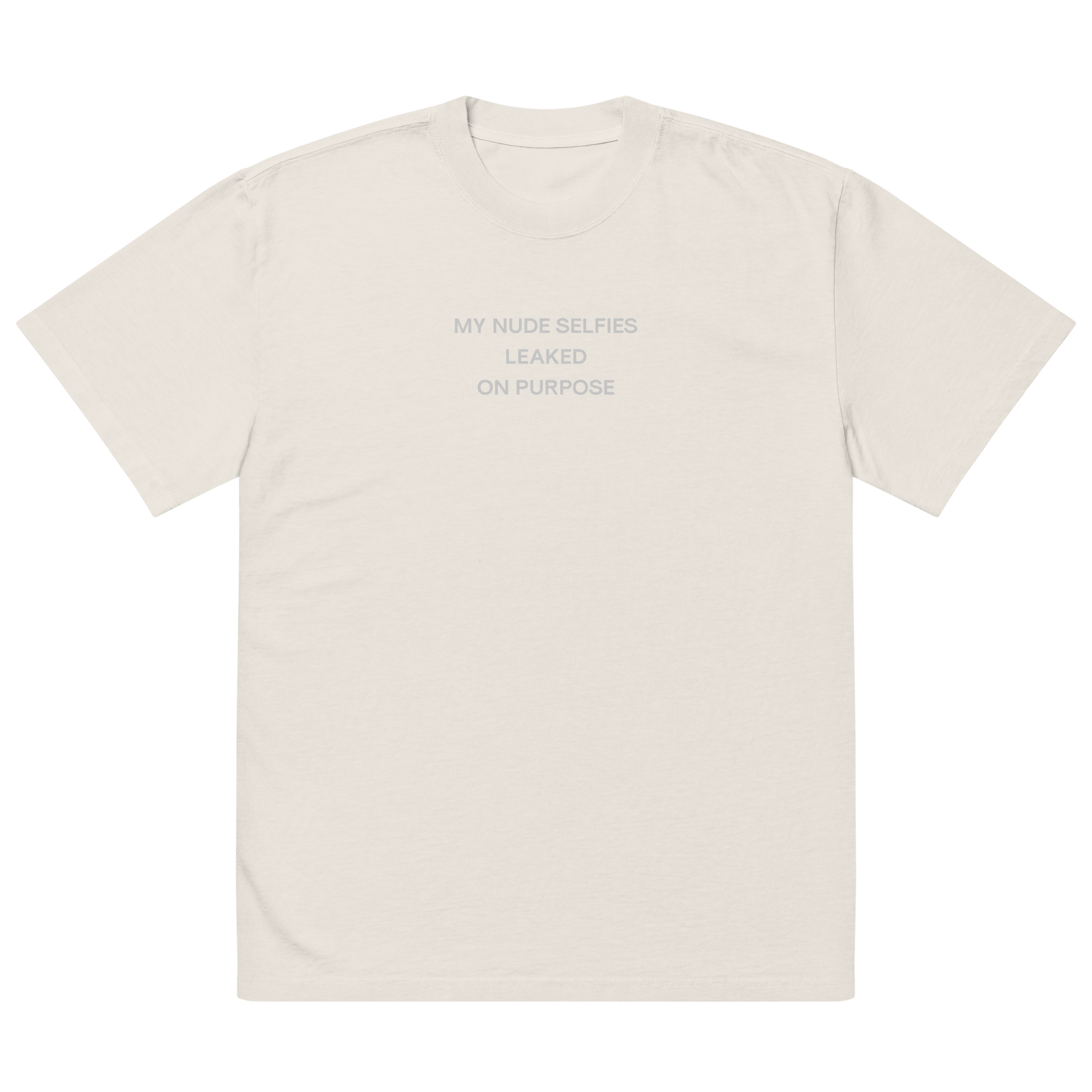 Oversized unisex T-shirt by NECROBLEND — self-disclosure unit from The Unspoken capsule, front view in faded bone. Speculative apparel piece echoing the aesthetics of exposure.