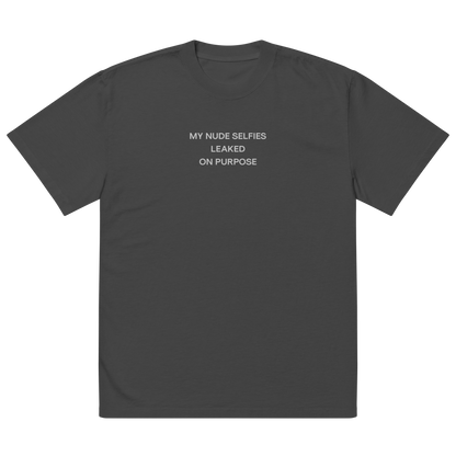 Oversized unisex T-shirt by NECROBLEND — self-disclosure unit from The Unspoken capsule, front view in graphite. Speculative apparel referencing intentional exposure.