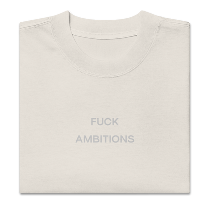 Folded view of NECROBLEND’s oversized unisex T-shirt — unspoken symptom in faded bone. A softshell for resistance, printed as speculative apparel.