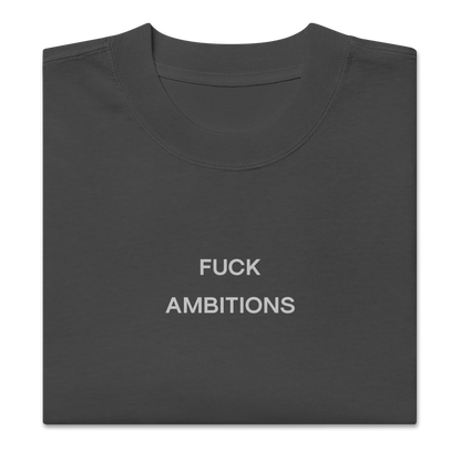Folded view of NECROBLEND’s oversized unisex T-shirt — unspoken symptom in graphite. An anti-ambition imprint archived in speculative apparel format.