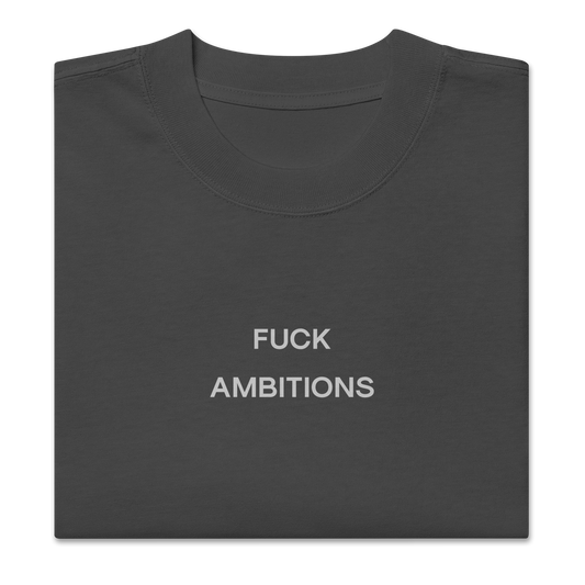Folded view of NECROBLEND’s oversized unisex T-shirt — unspoken symptom in graphite. An anti-ambition imprint archived in speculative apparel format.